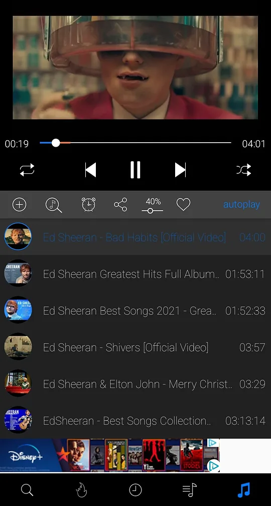iTube now playing screen with sleep timer, share, volume boost and favorite buttons above the queue